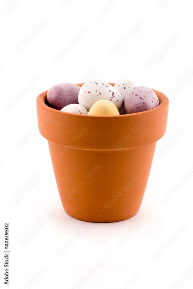 Pot of easter eggs over white Pot of easter eggs over white