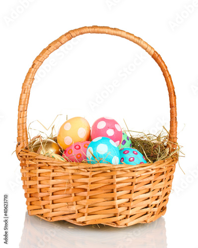 Colorful Easter eggs in the basket isolated on white