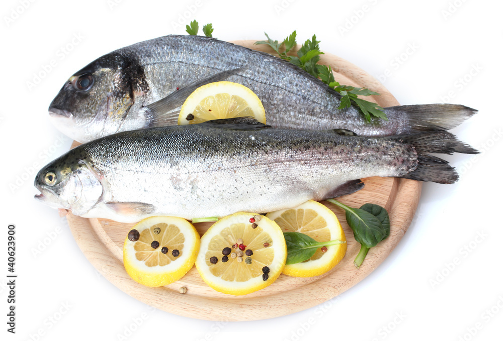 Fresh fishes with lemon, parsley and spice