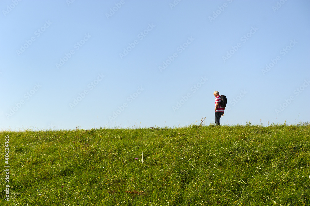 Man walking at dike