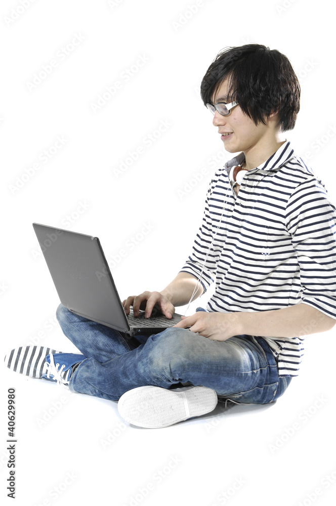 Happy and relax young man using laptop on the floor Happy and relax young man using laptop on the floor