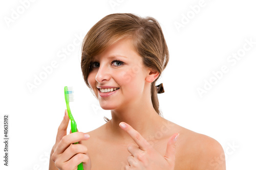 Attractive woman brushing teeth isolated on white background