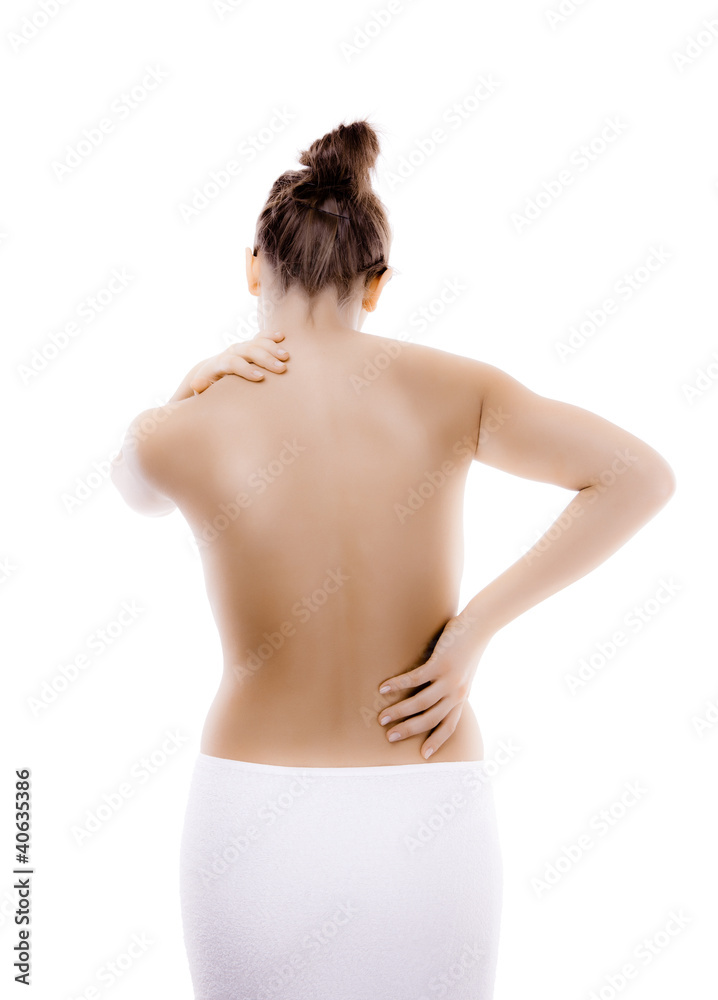 Woman massaging pain back isolated on white background Woman massaging pain back isolated on white background