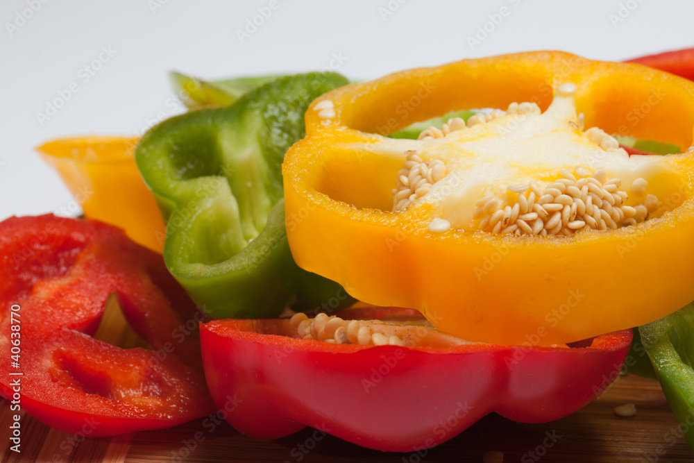 close up of red, yellow and green peppers close up of red, yellow and green peppers