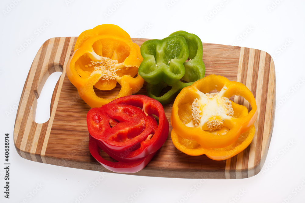 close up of red, yellow and green peppers close up of red, yellow and green peppers