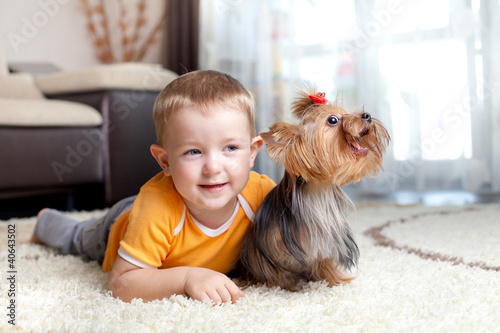 little boy playing and hugg...