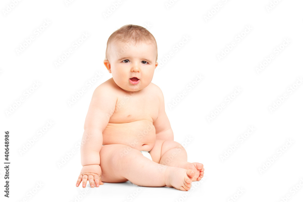 A 9 month old baby in diapers sitting A 9 month old baby in diapers sitting