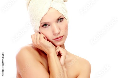 Pensive beautiful young woman after shower