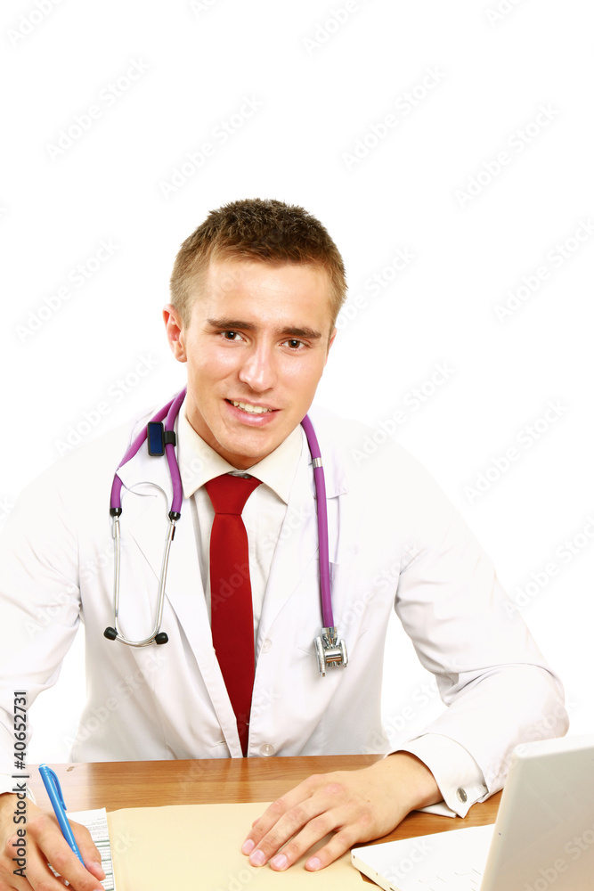 The doctor writing in office