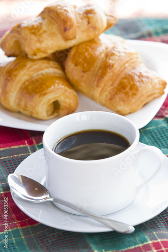 Breakfast with a cup of black coffee and croissants, Shallow DOF