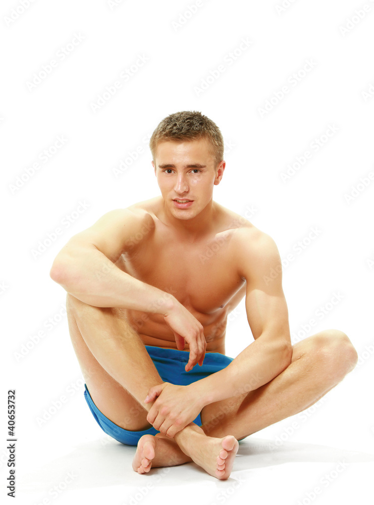 Muscular man resting after a workout Muscular man resting after a workout