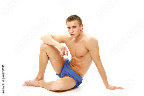 Muscular man resting after a workout