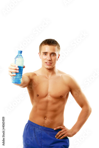 Man drinking water after workout in the gym