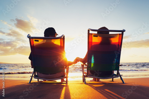 Happy Romantic Couple Enjoying Beautiful Sunset at the Beach