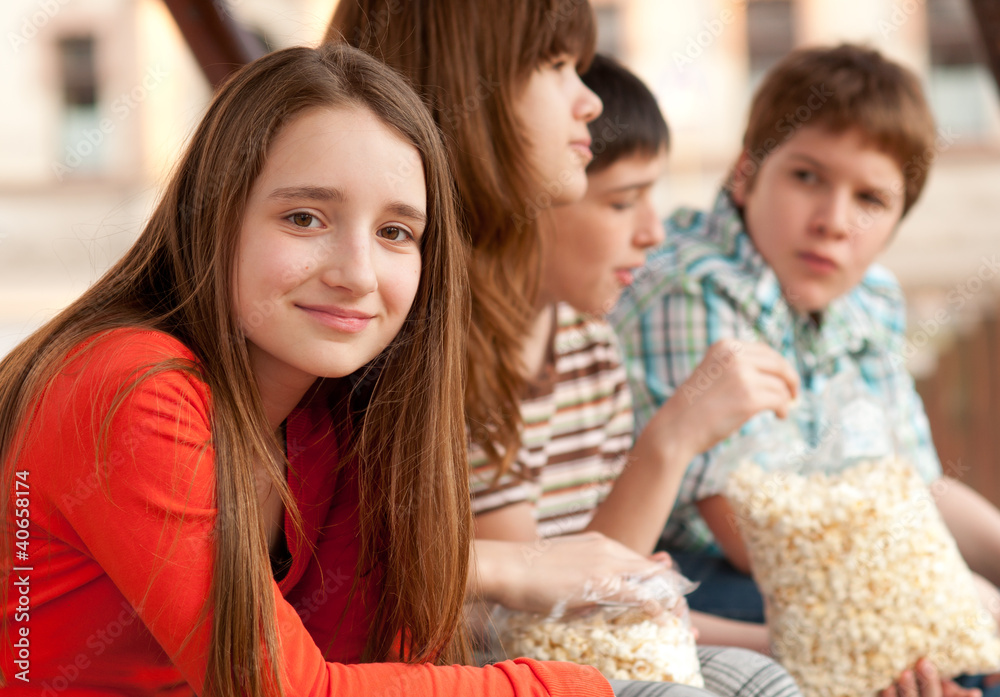 Smiling teenage girl spending time with her friends Smiling teenage girl spending time with her friends