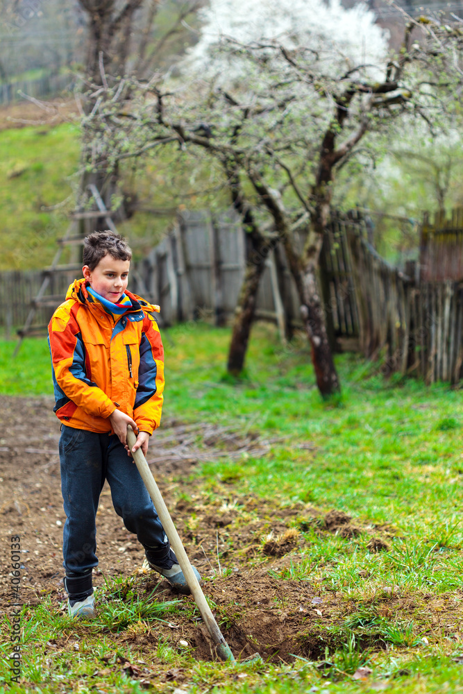 Boy digging in the ground