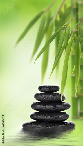 Stacked massage stones and bamboo design