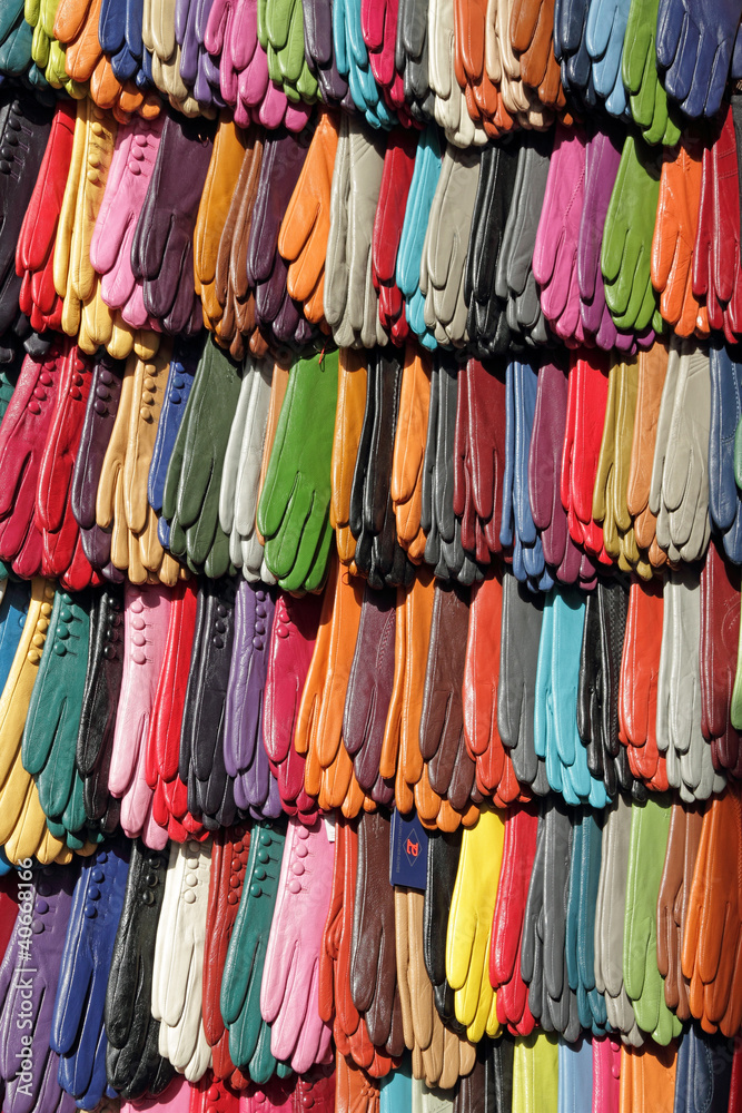 many isolated colorful leather gloves in shop window
