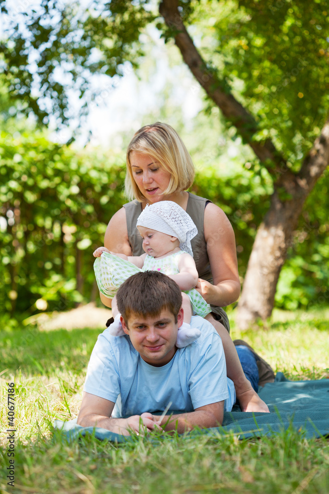 Fototapeta premium Family having picnic in park