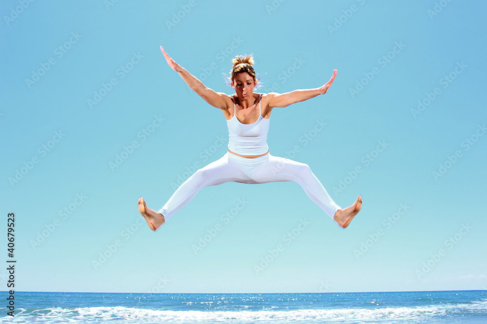 young beautiful woman jumping