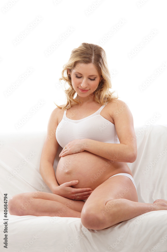 A young and happy blond pregnant Caucasian woman A young and happy blond pregnant Caucasian woman