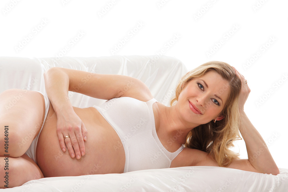 A young and happy blond pregnant Caucasian woman A young and happy blond pregnant Caucasian woman
