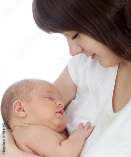 Close-up young mother holding her newborn baby isolated on white
