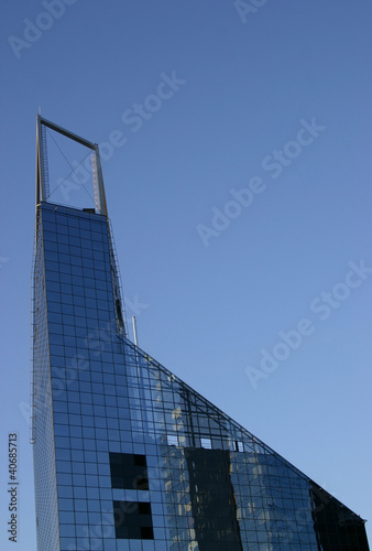 Building triangular high-rise from glass for offices