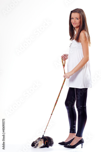 Young woman with a rabbit on a leash