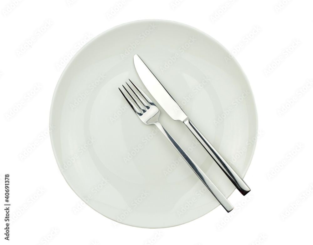 Knife, fork and plate isolated on white background Knife, fork and plate isolated on white background