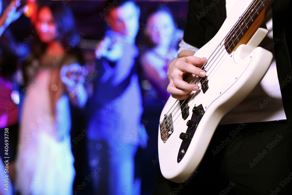 Young guitar player performing in night club Young guitar player performing in night club