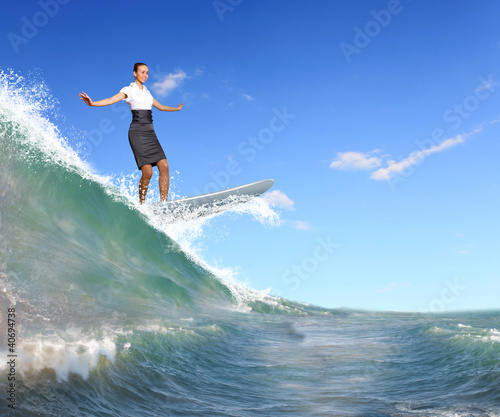 Photography Businesswoman surfing on the sea waves