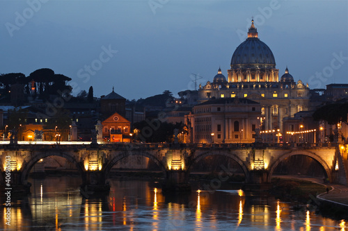 Canvas Print The Vatican City seen from the river Tiber at sunset.