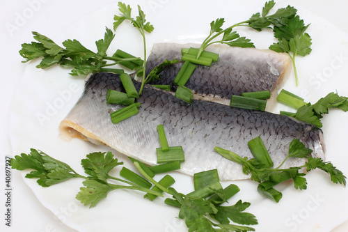 Herring on white plate photo