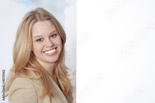 Closeup portrait of a happy young business woman smiling