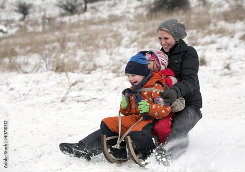Family enjoy tobogan ride together