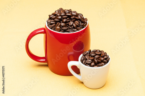 Red and white cups with coffee beans