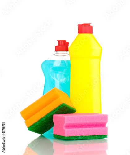 Dishwashing liquids and sponge isolated on white
