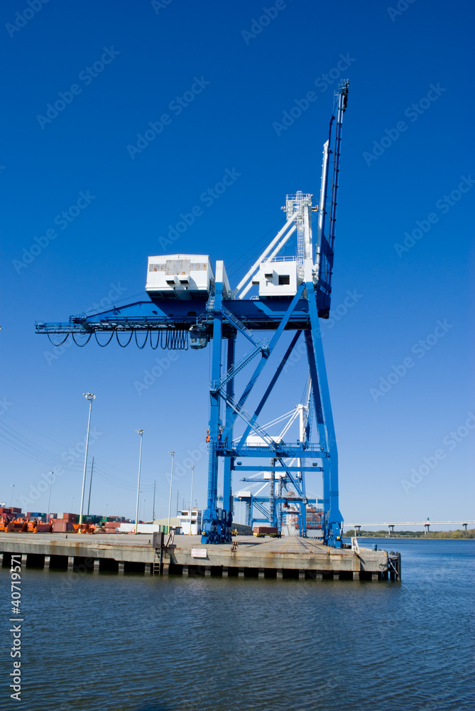 Steel cargo crane with shipping containers