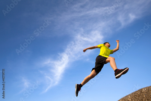 young runner with cloud background