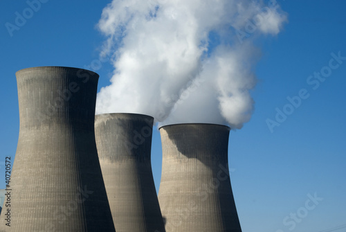 Three cooling towers (closed-loop system) at a power plant. photo