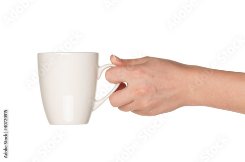 Hand with white cup
