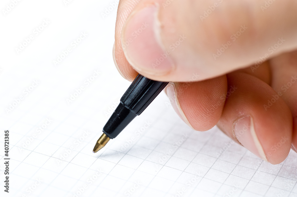Writing. An hand who writes in a paper sheet with a pen Writing. An hand who writes in a paper sheet with a pen