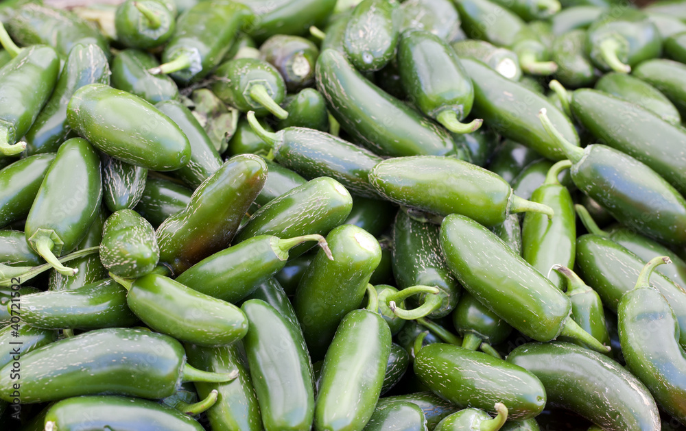 Pile of Jalapeno Peppers for sale at a farmers market Pile of Jalapeno Peppers for sale at a farmers market