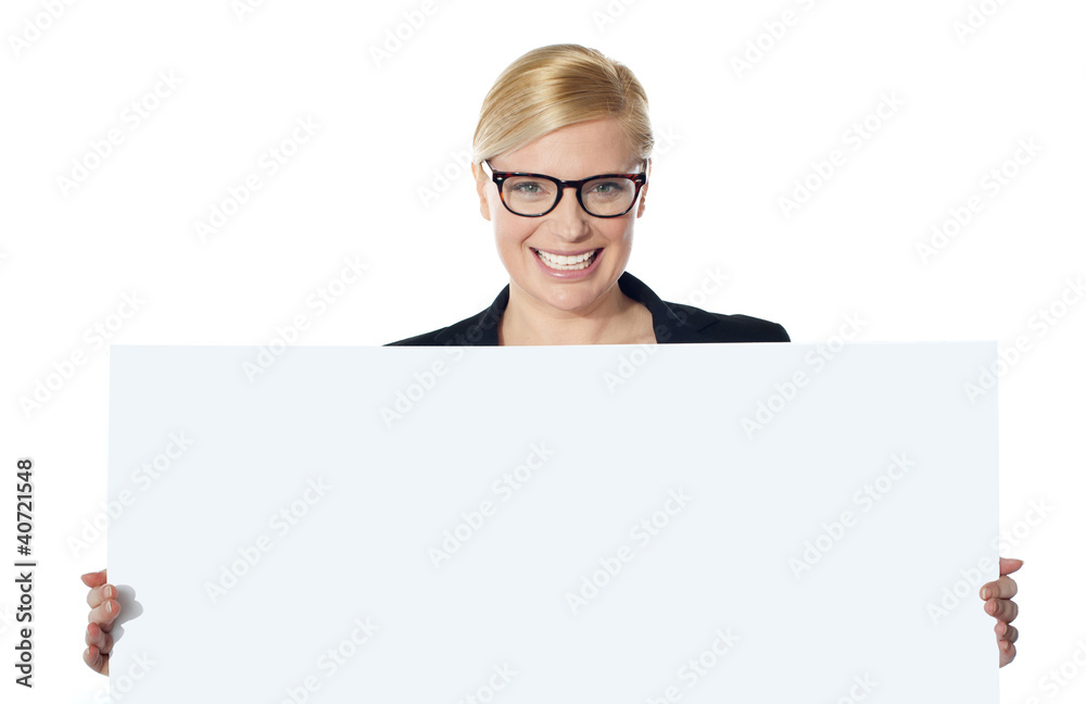Portrait of happy woman showing blank placard Portrait of happy woman showing blank placard