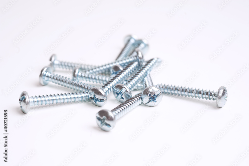 Heap of screws closeup on white background Heap of screws closeup on white background