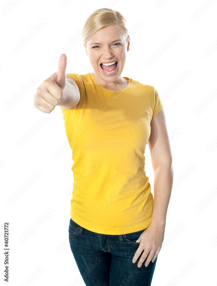 Smiling gorgeous girl showing thumbs-up Smiling gorgeous girl showing thumbs-up