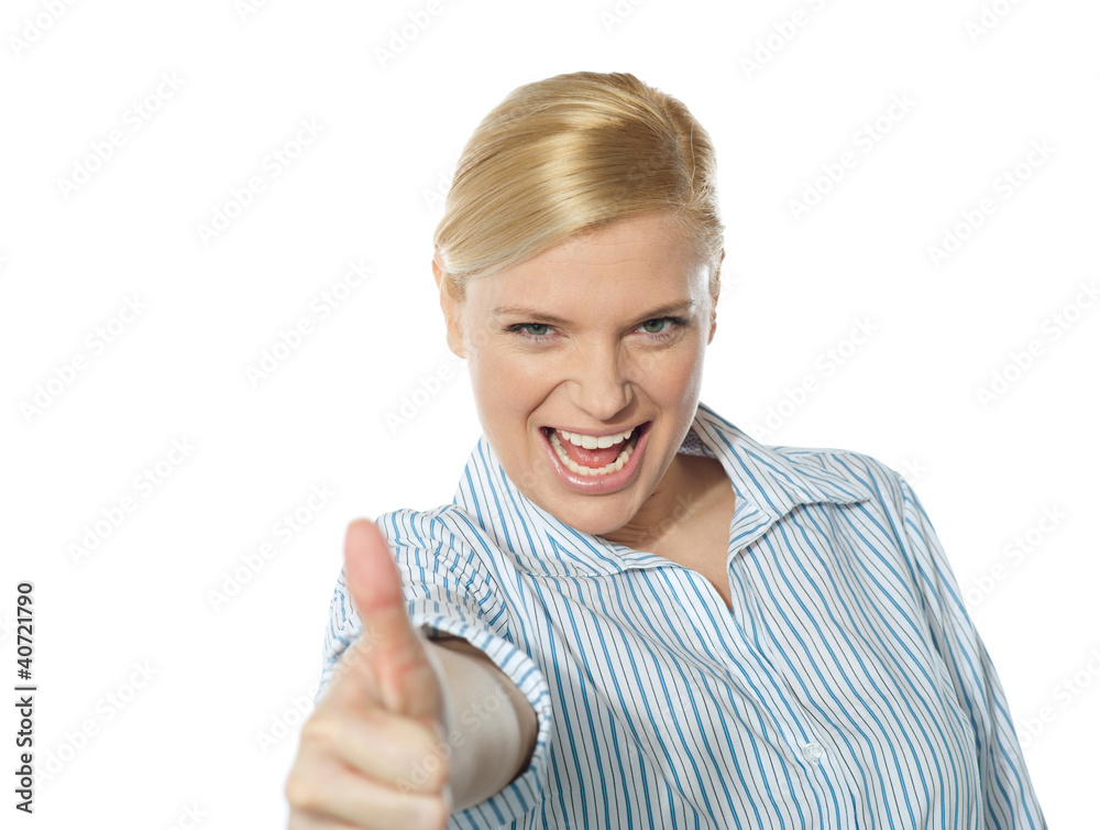 Successful businesswoman showing thumbs-up Successful businesswoman showing thumbs-up