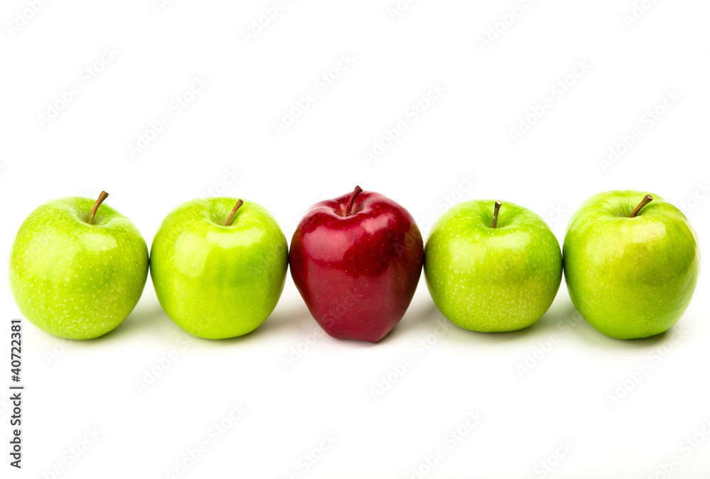 Red apple among green apples isolated on a white Red apple among green apples isolated on a white