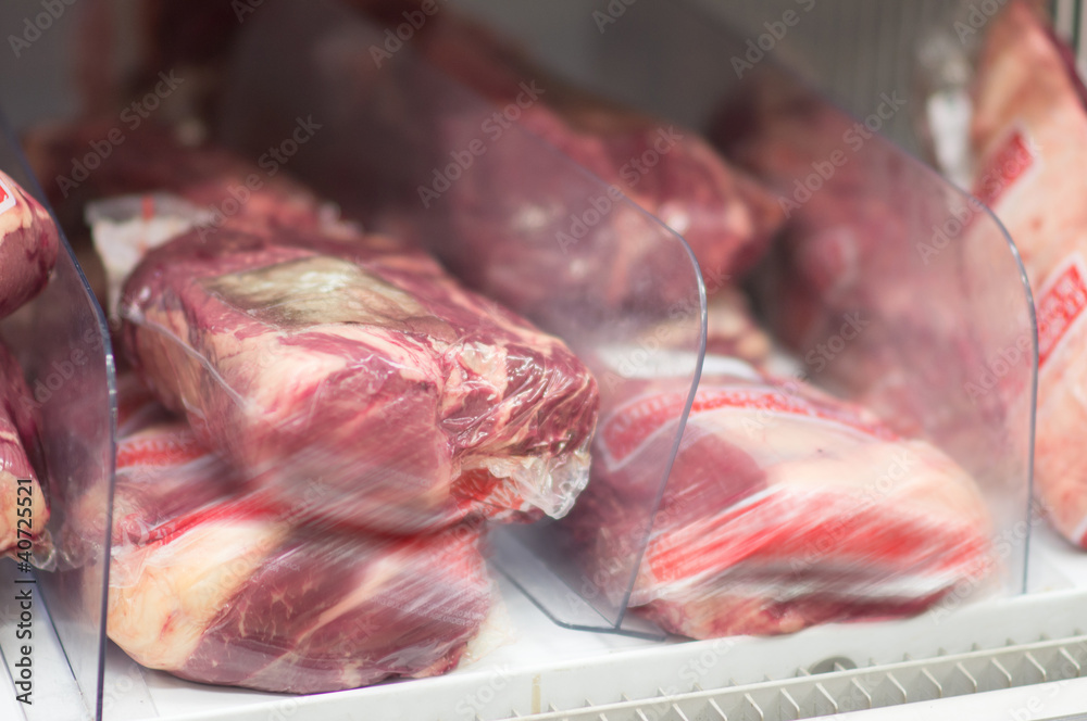 Variety of meat in packages in supermarket